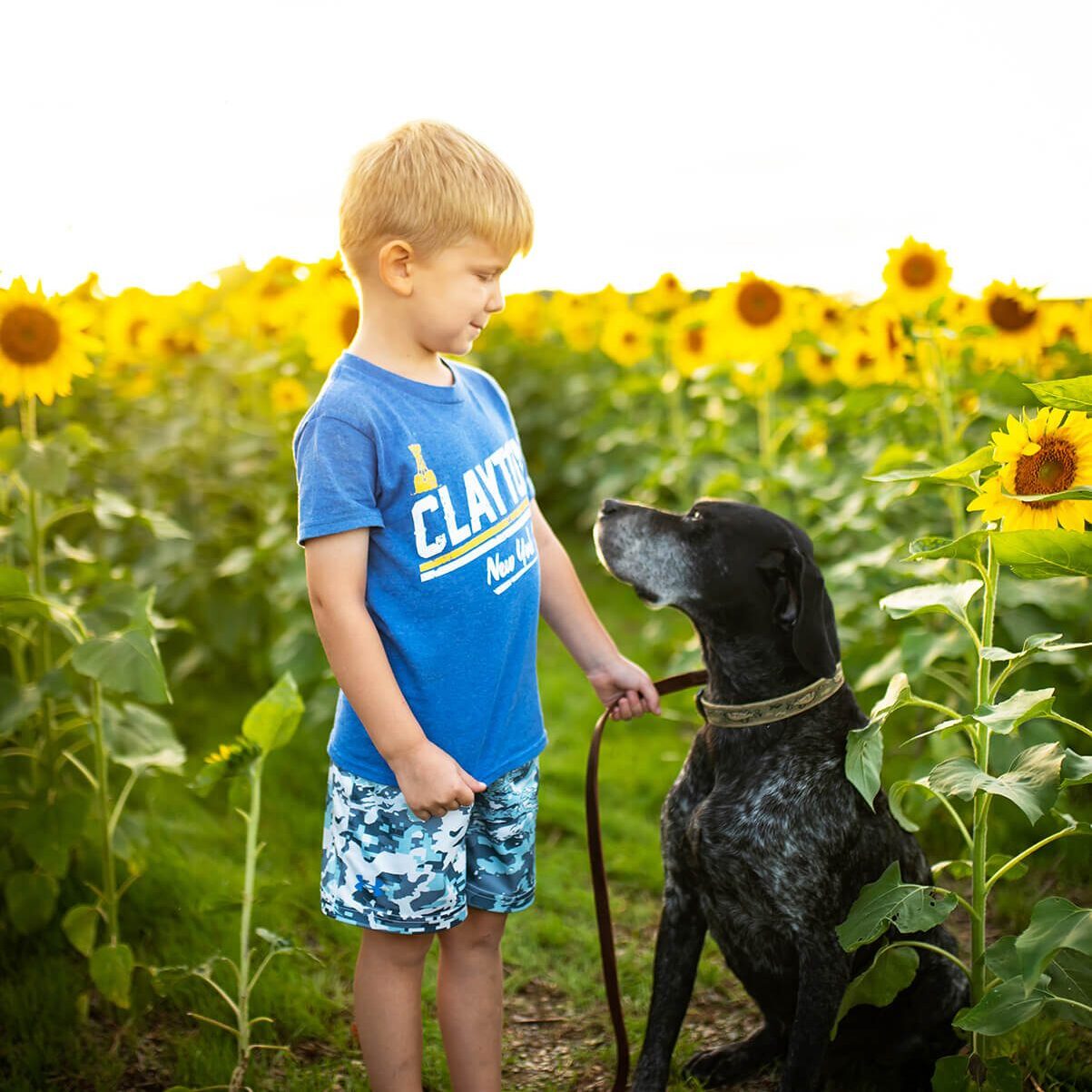 Boy With Black Dog